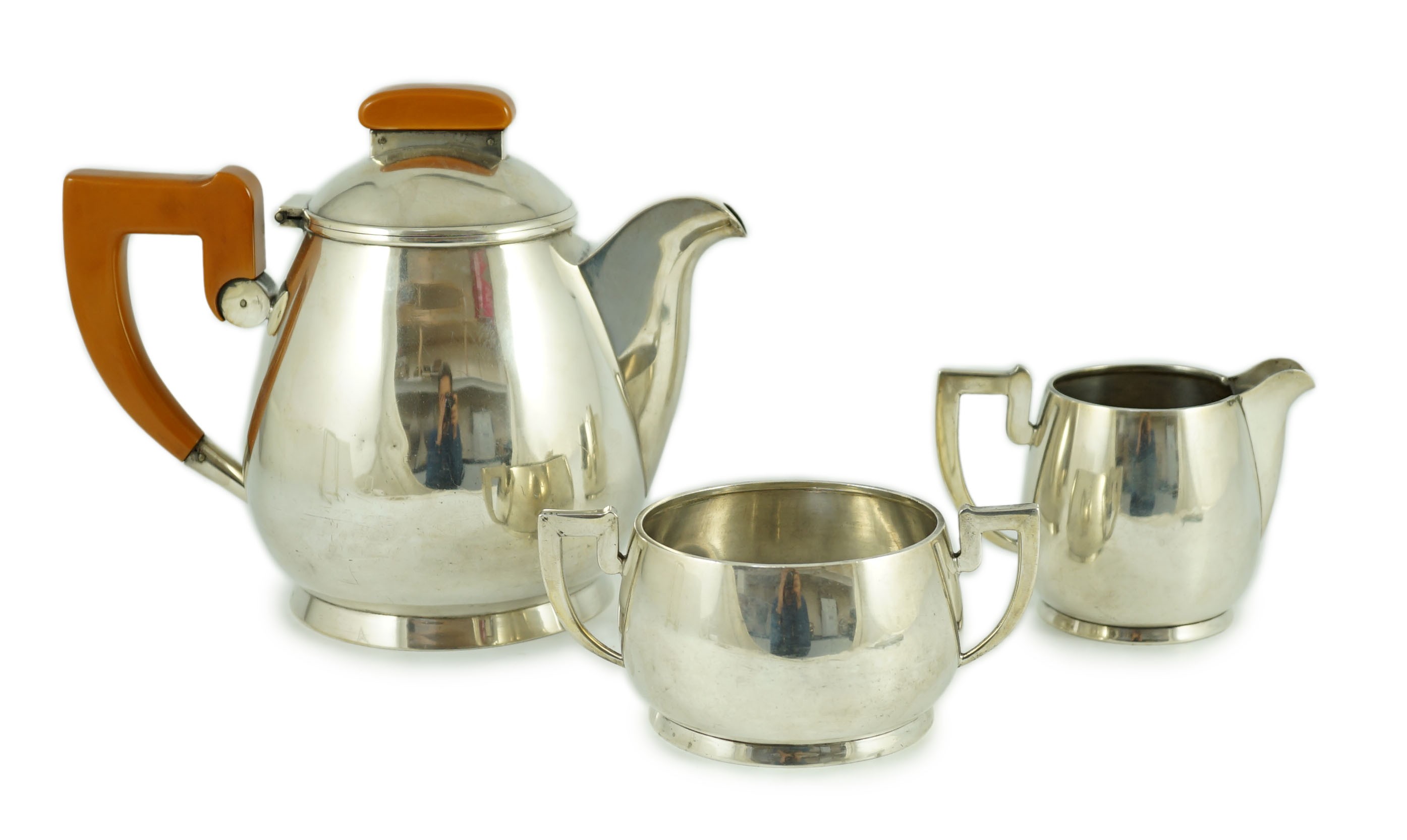 A stylish George VI silver three piece tea set, by Ls Sl